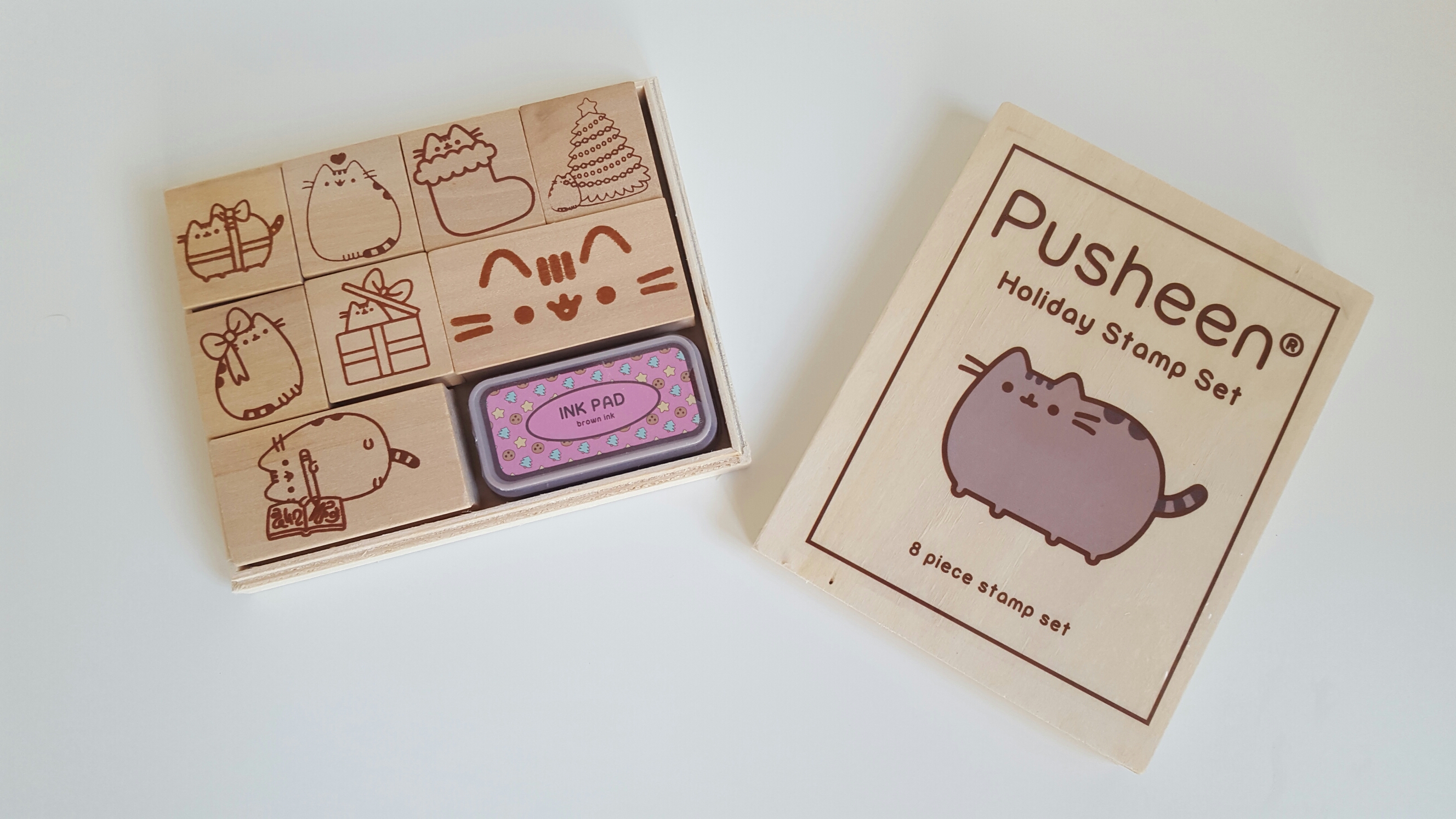 The Pusheen stamp set opened to show off the 8 different stamp designs