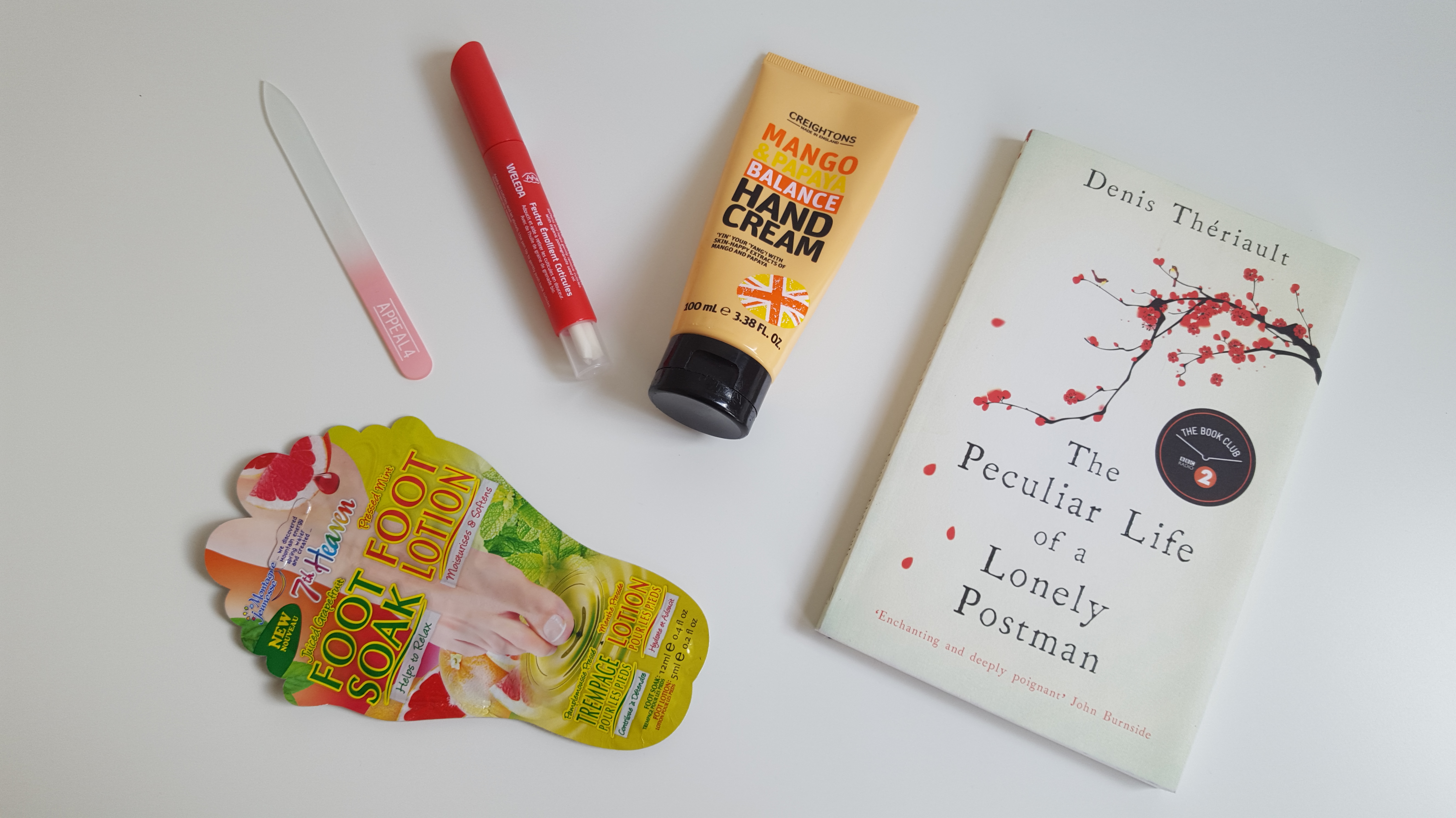A nail file, nail care pen, hand cream, and foot soak and lotion. 
