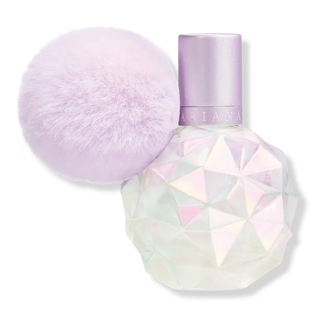 The Moonlight perfume which is in a white shimmery bottle with a geometric design. The bottle also has a light purple fluffy ball attached to it.