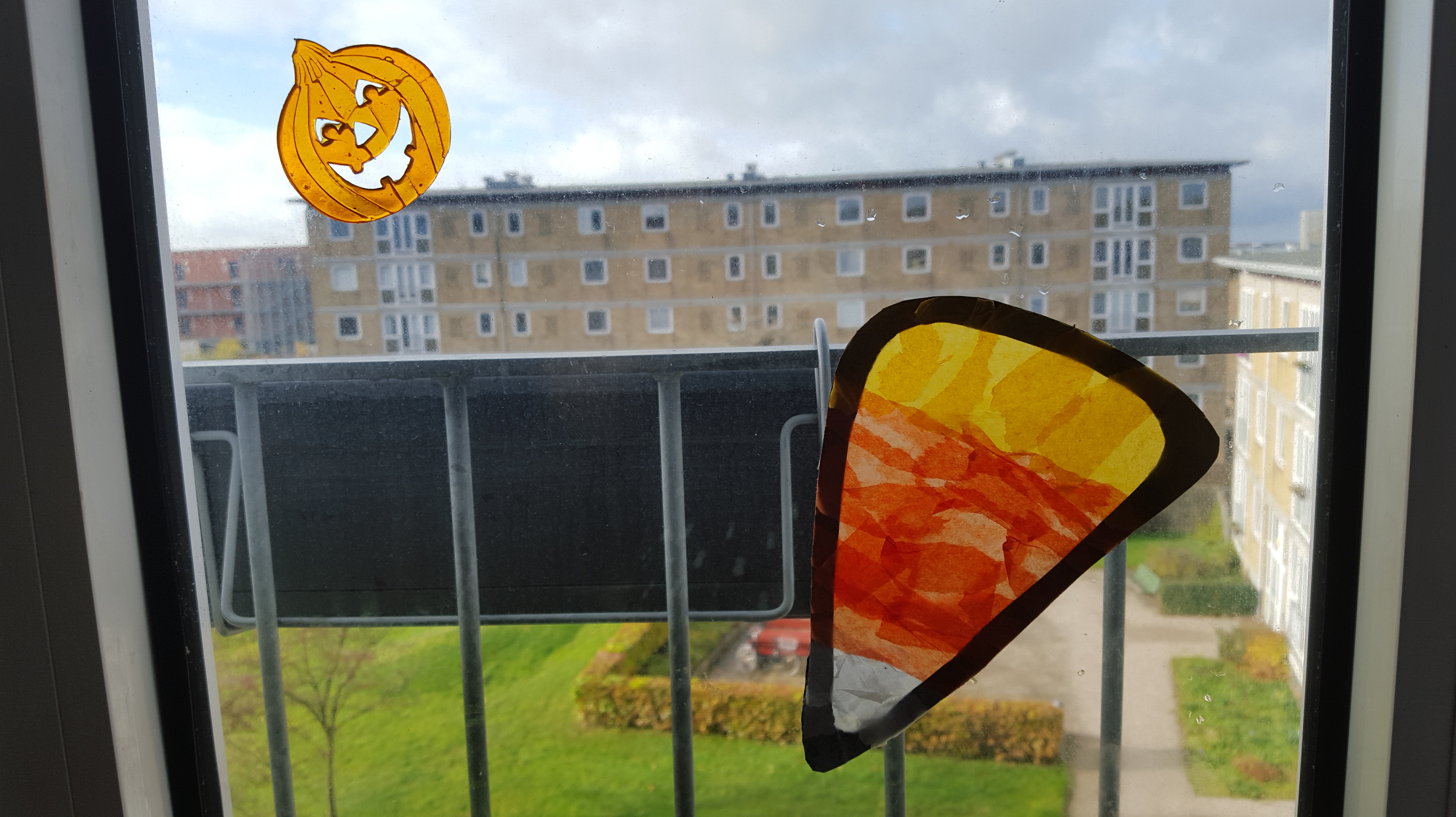 Crafted tissue paper candy corn and pumpkin window cling