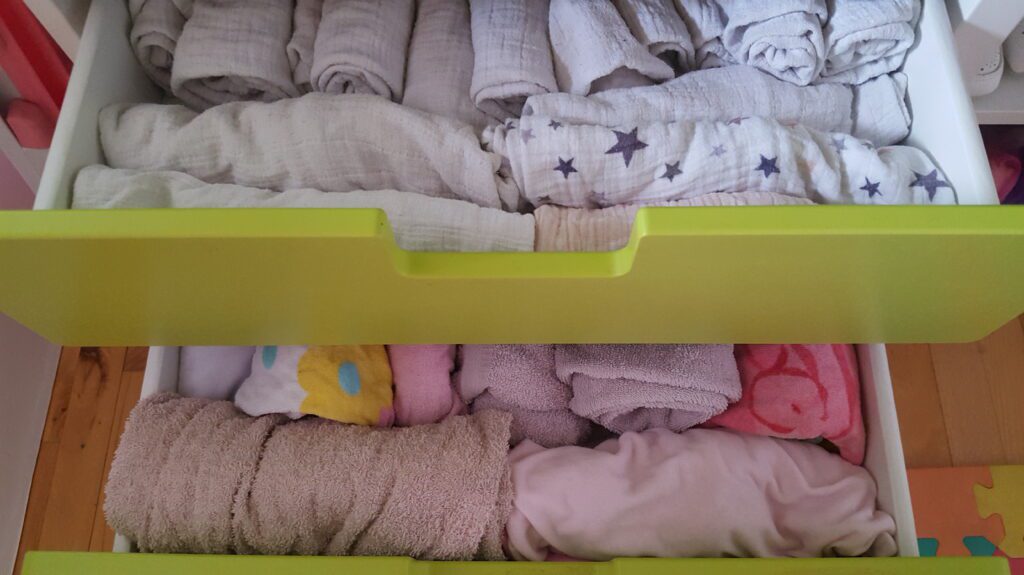 My daughter's towels folded and stored in her dresser drawers