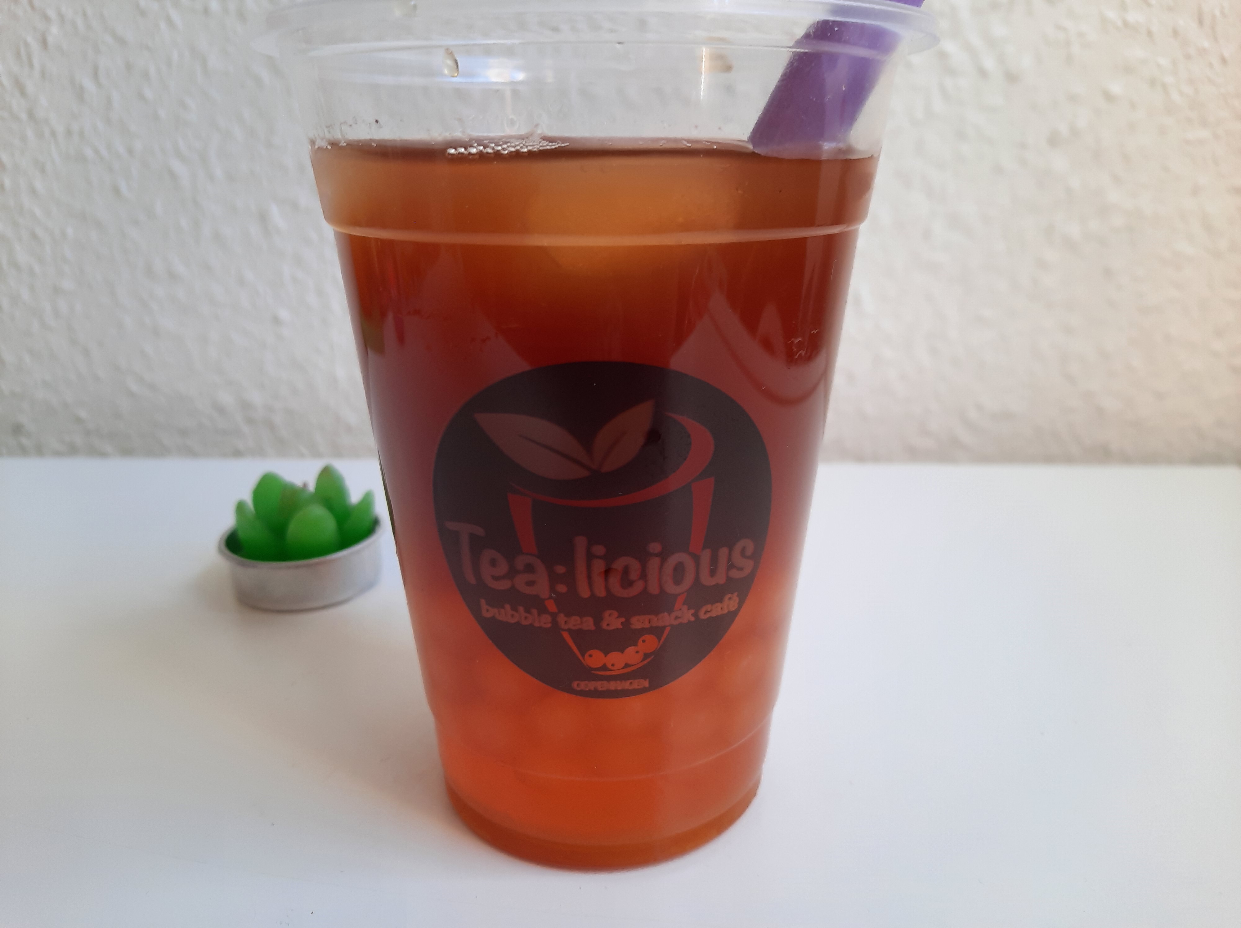 The peach-mango bubble tea with mango popping boba pearls