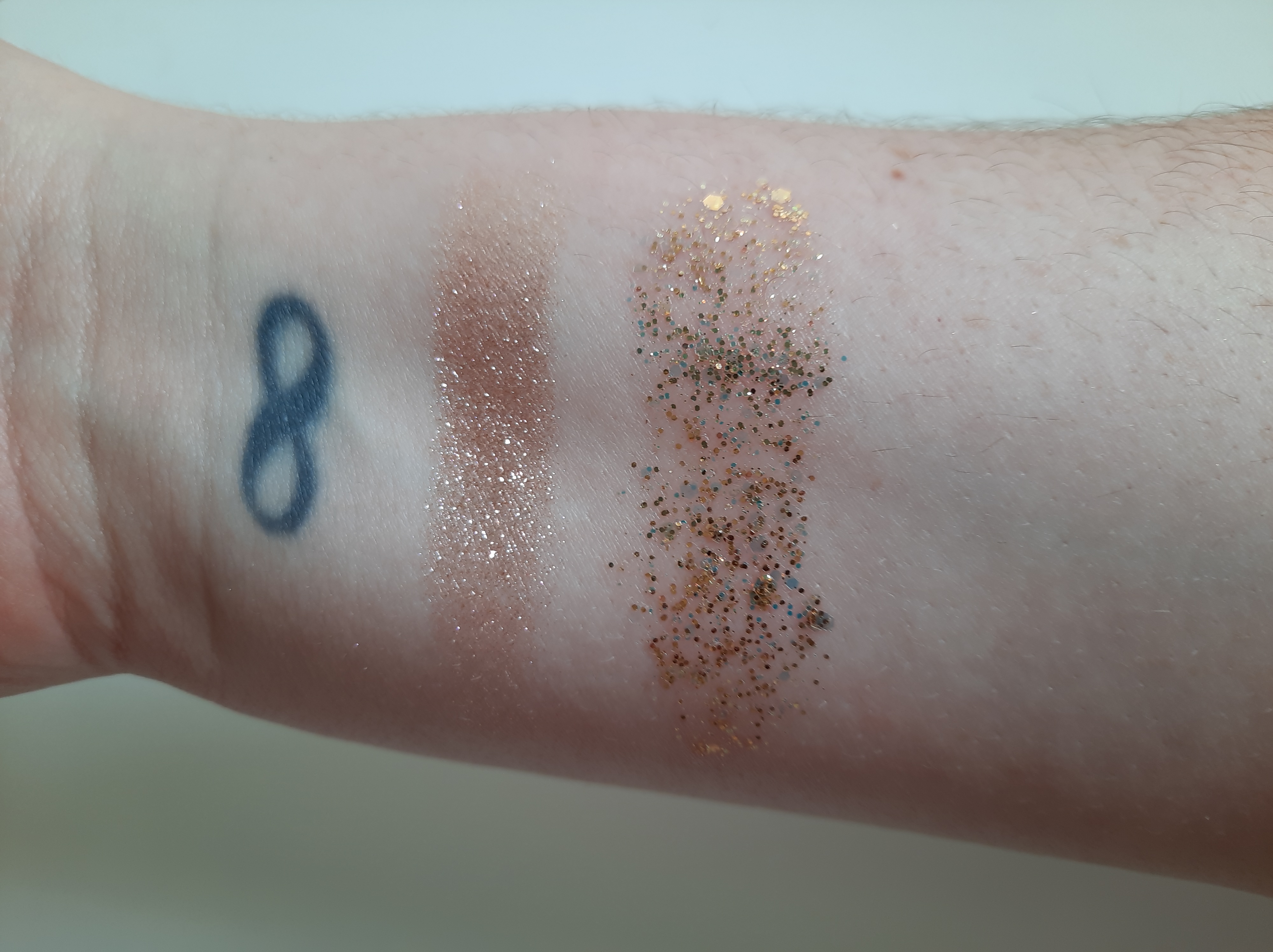 Swatches of the Balloon Pop Super Shock Shadow and Bellionaire Glitter Gel from the collection