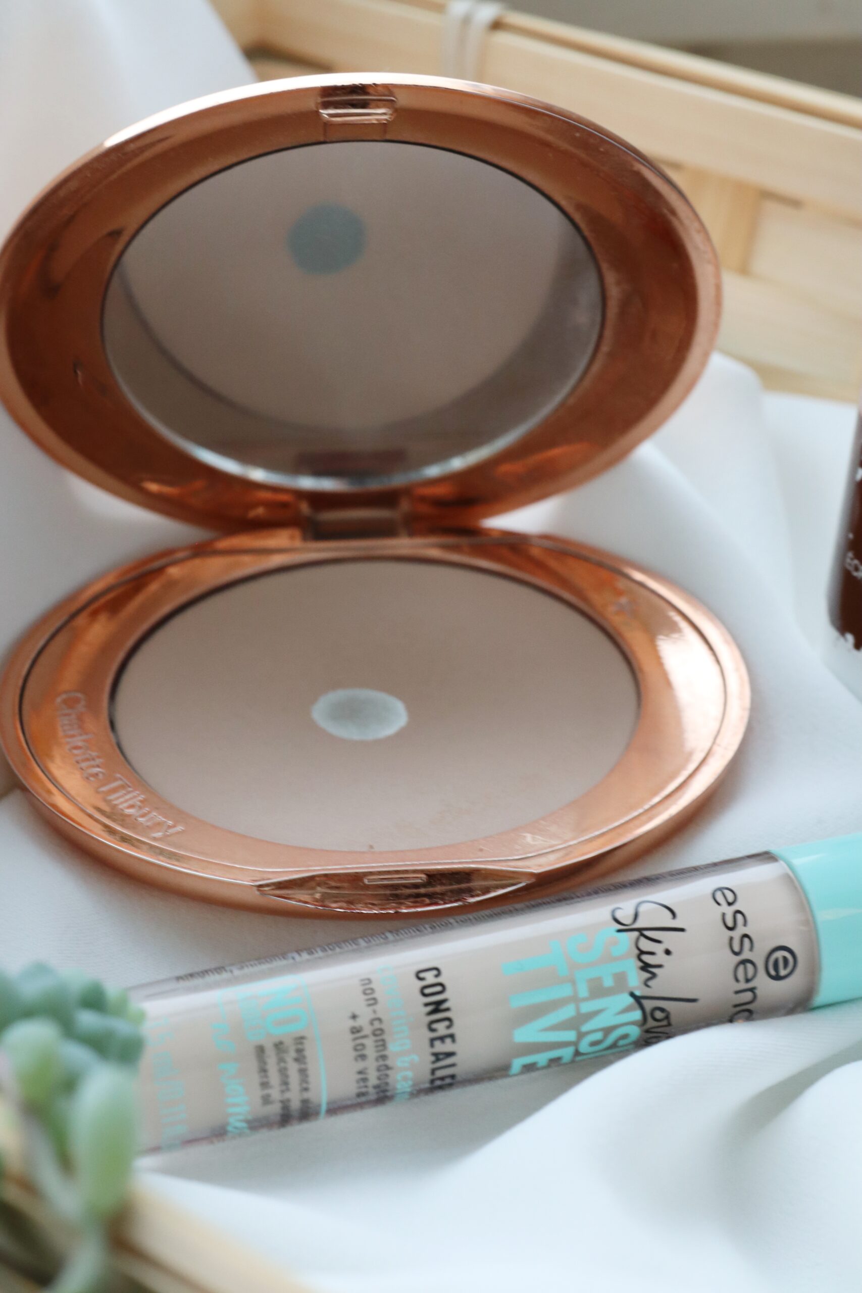 The Charlotte Tilbury airbrush flawless finishing powder and the essence sensitive concealer
