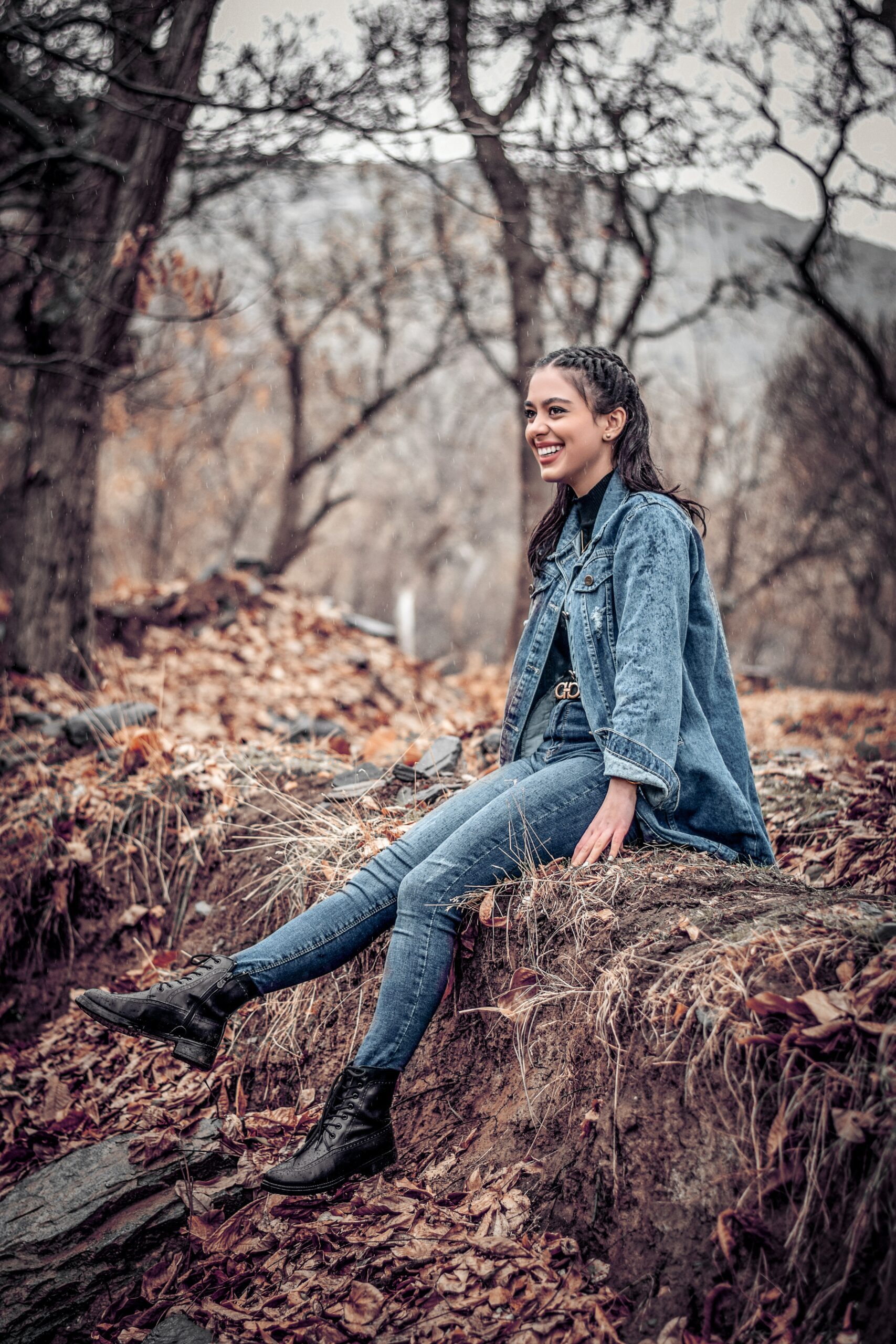 A woman wearing a denim outfit with jean bottoms and a jean jacket. 