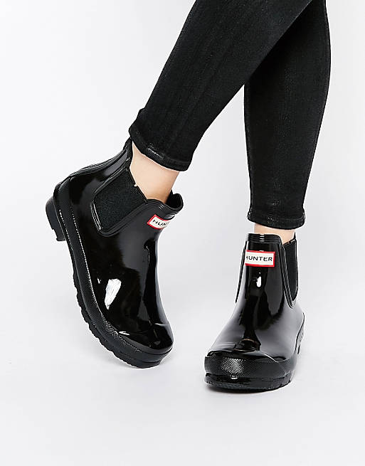 A pair of black Hunter ankle rain boots