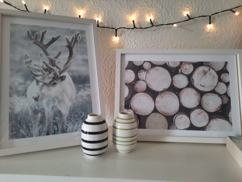 The Winter Reindeer and Pile of Wood posters from Poster Store