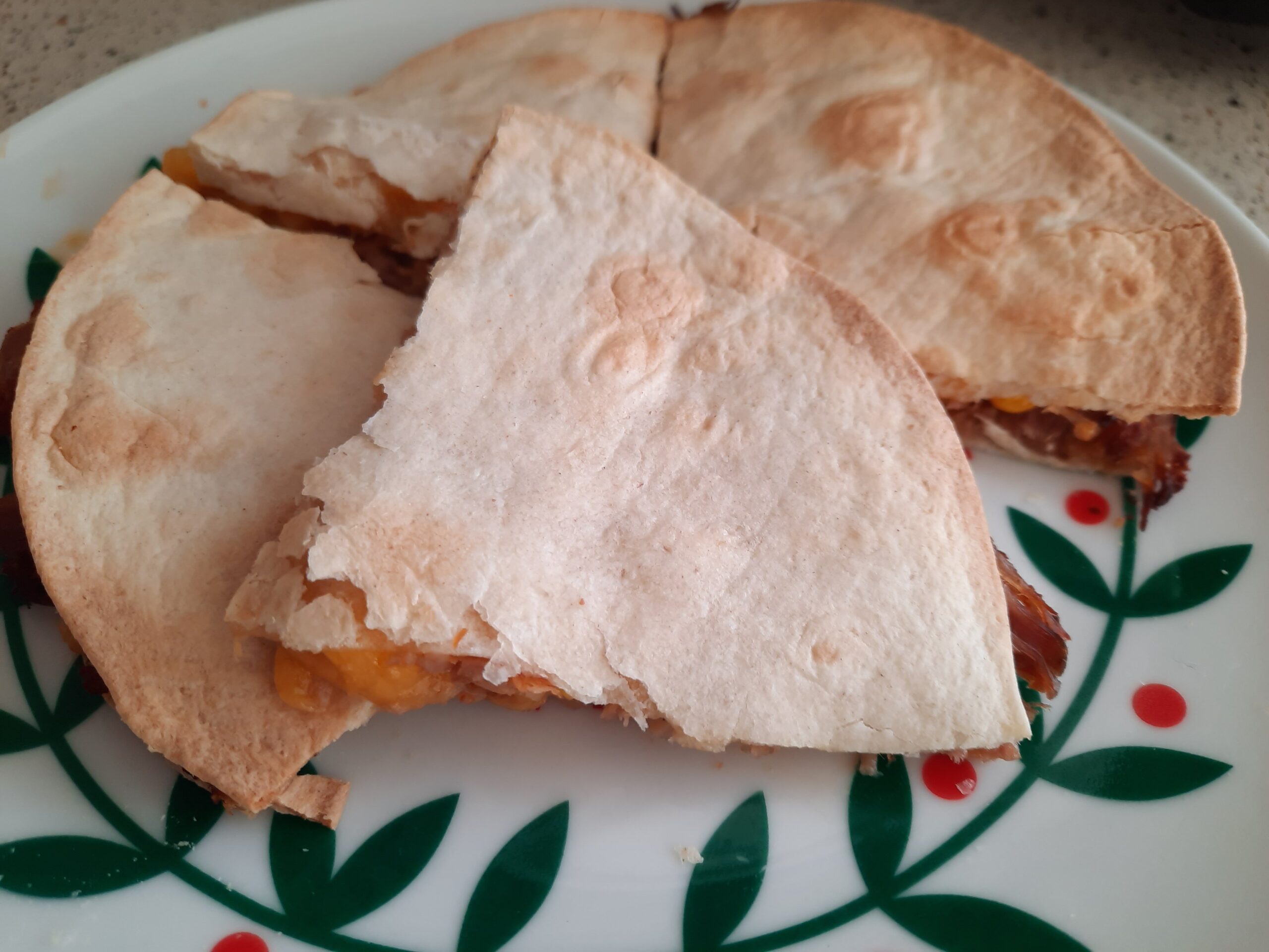 A quesadilla I made in the air fryer with pulled pork, cheese, and corn