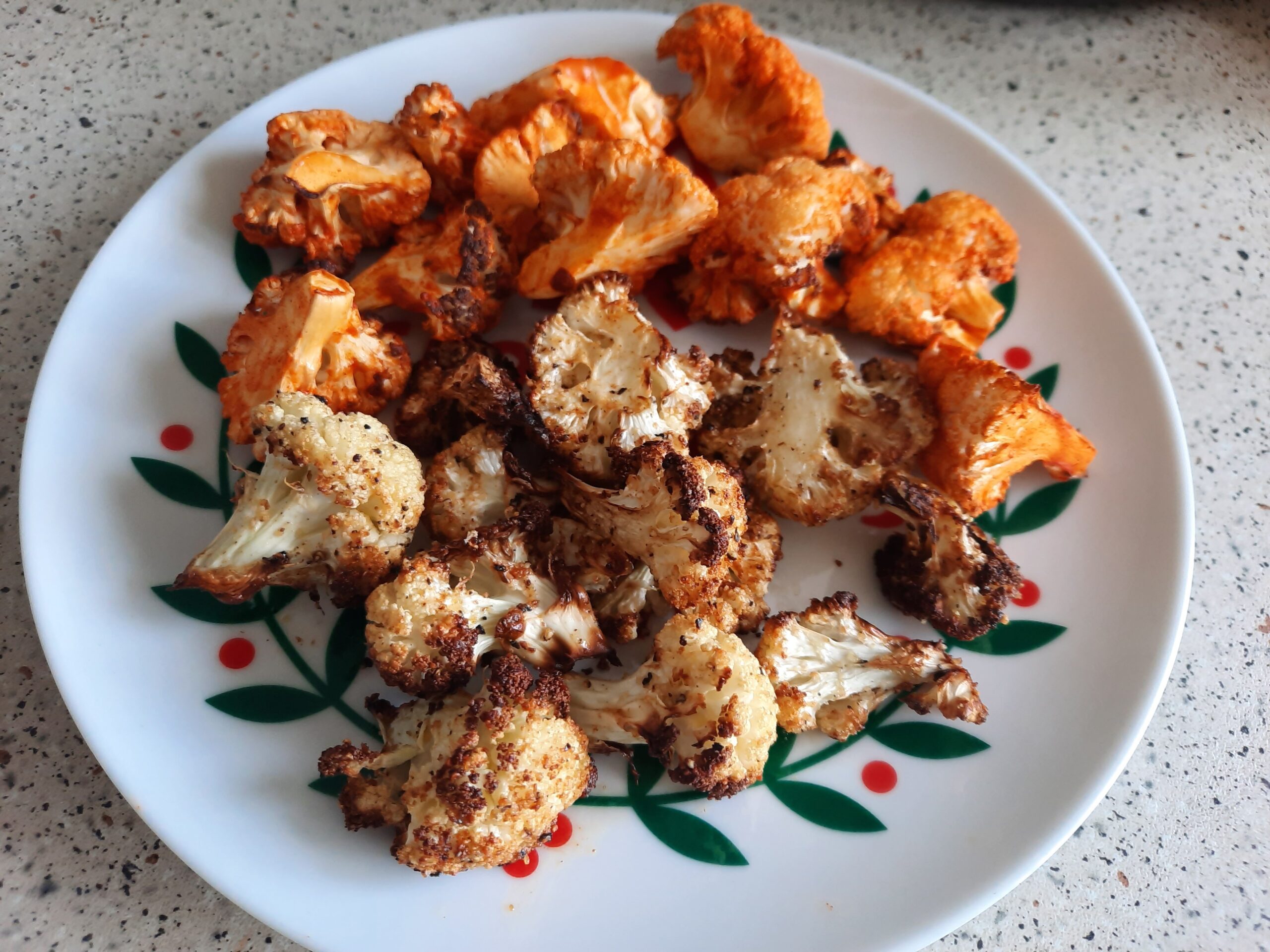 Two types of roasted cauliflower I made. One type has a buffalo wings sauce and the other is with seasoning