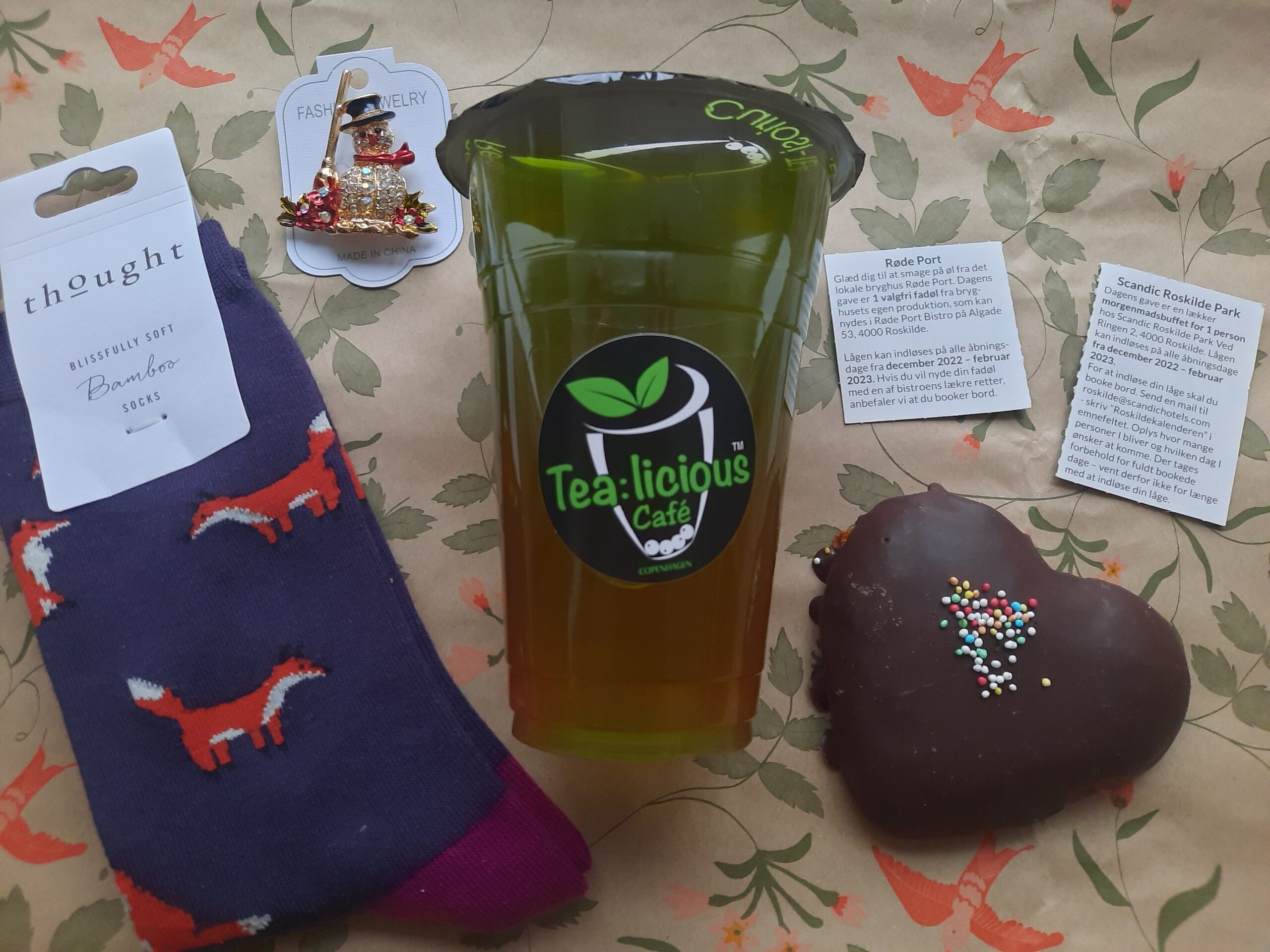 Some of the gifts I redeemed from the Roskilde calendar including the fox socks made from bamboo, the snowman brooch, the bubble tea, and the honey heart pastry 