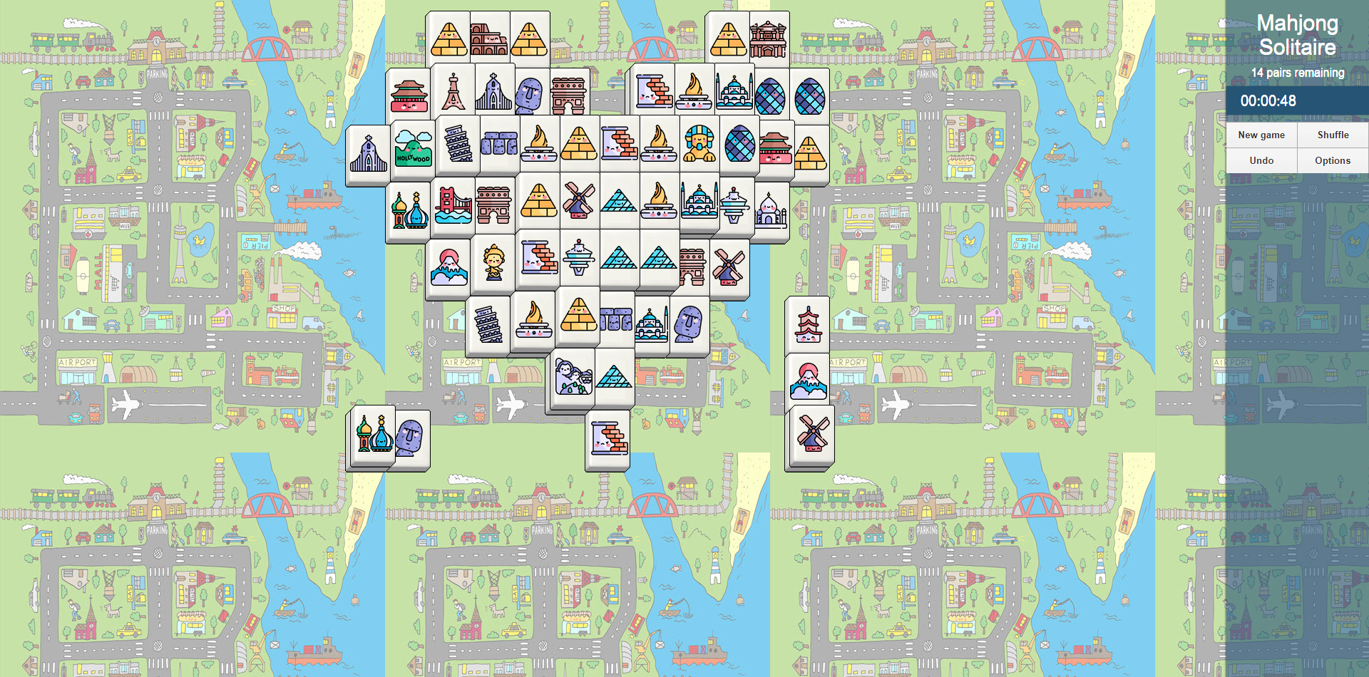 A screenshot of Mahjong Solitaire, which is the last of the educational online games in the list. The tiles are in a heart shape and some of the tile pairs have been found. There are 14 tile pairs remaining. 