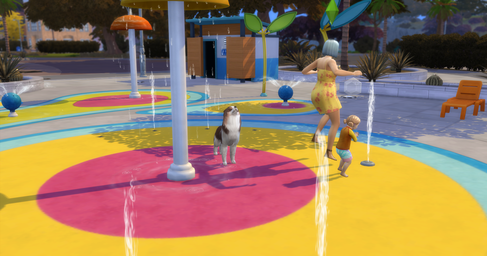 An adult sim, toddler, and their dogs playing at the splash pad