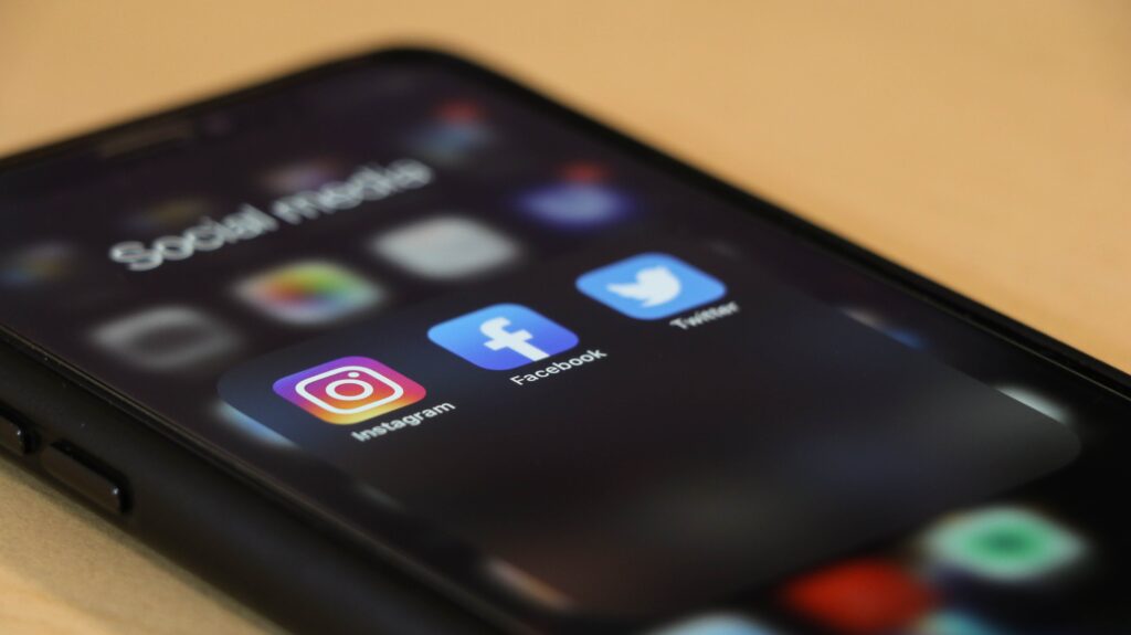 A phone that has the social media apps Instagram, Facebook, and Twitter