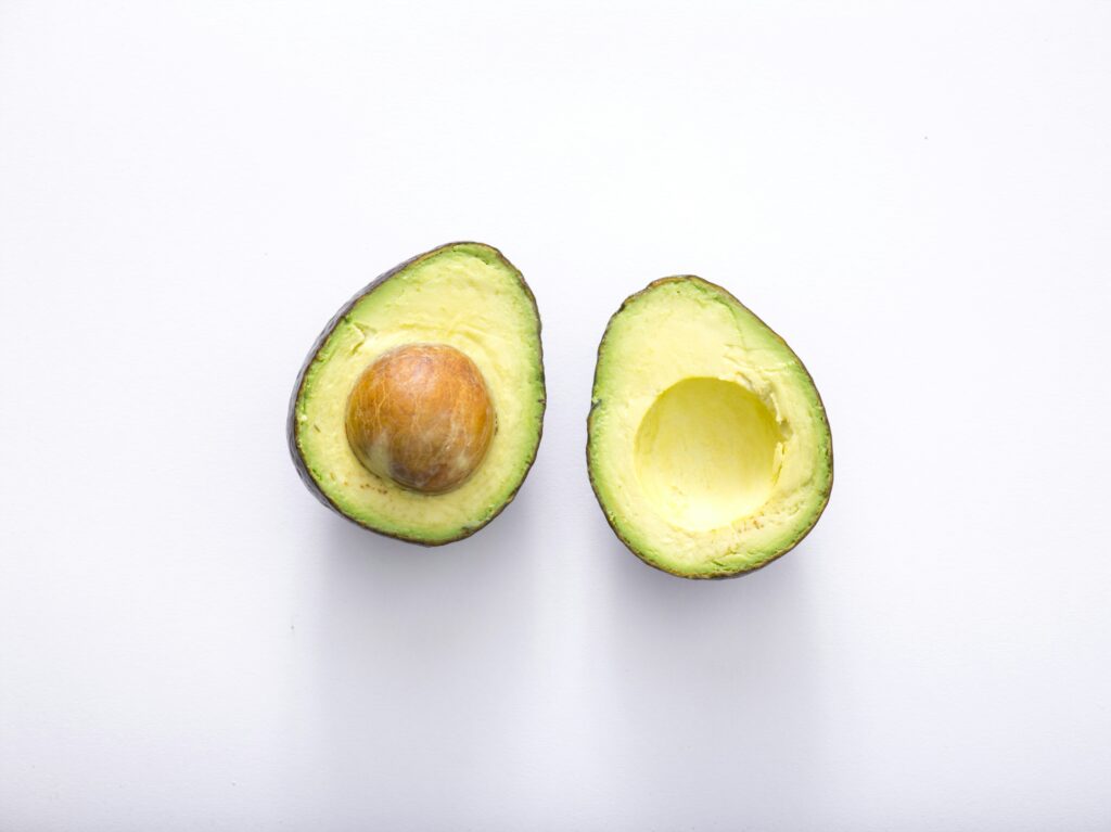 An avocado sliced in half
