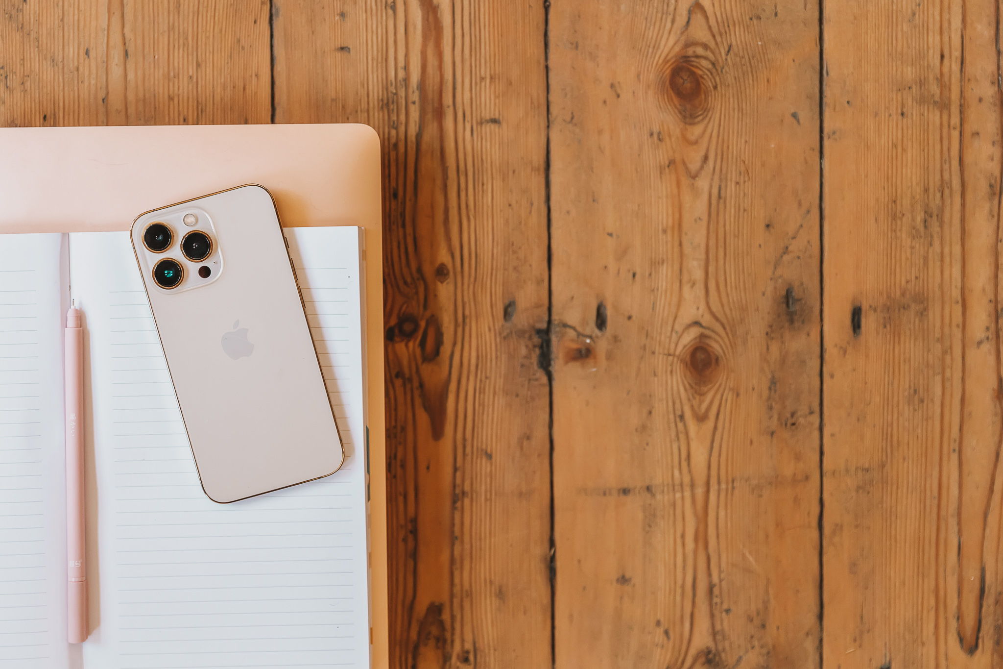 A phone on a wooden table