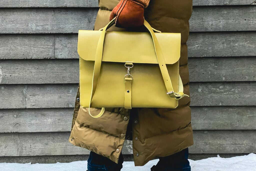A yellow satchel, which makes a good choice for handbags. 