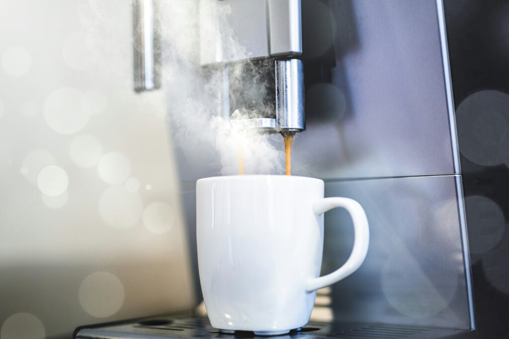 A white mug with steam coming out of it