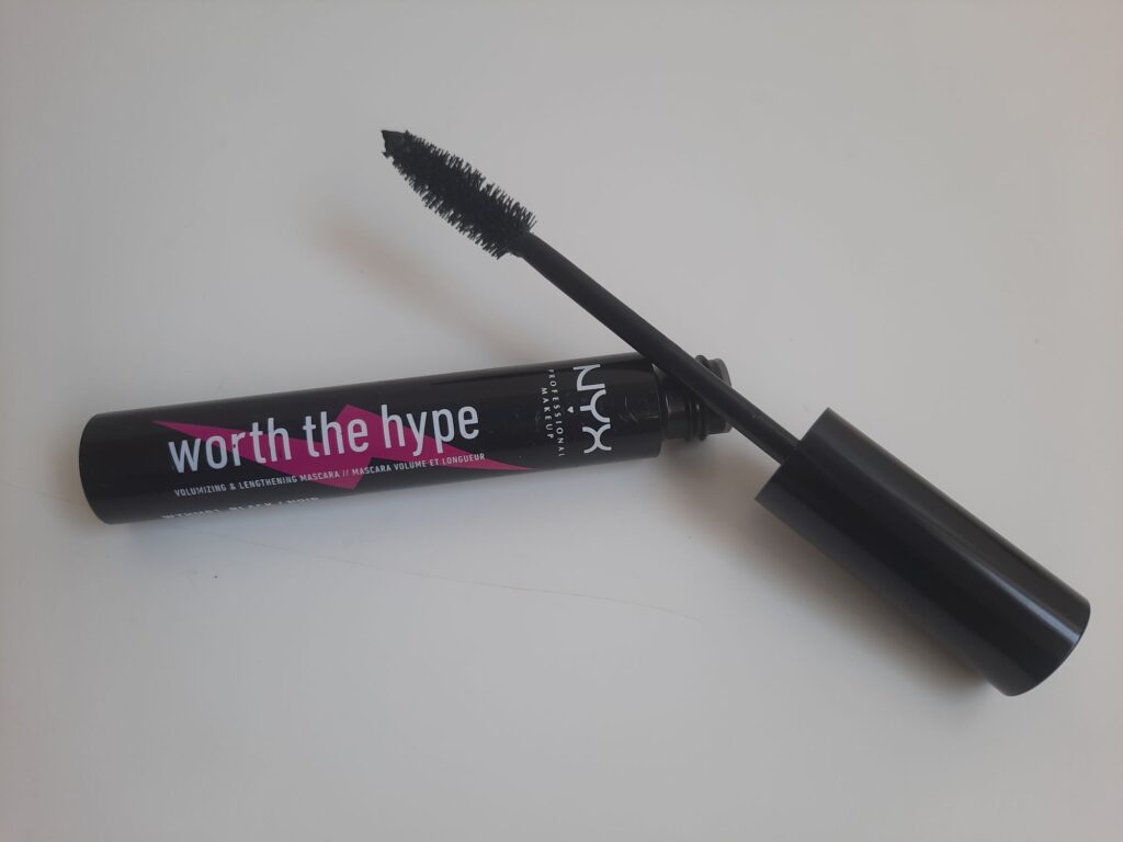 The full size of the NYX Worth the Hype Mascara which has a black tube with a pink lightening bolt on the side