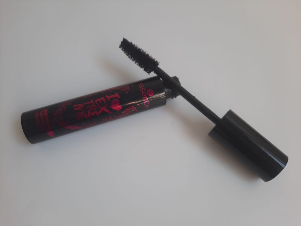 The full size of the Essence I Love Extreme Mascara which is a black tube with pink lettering on the side