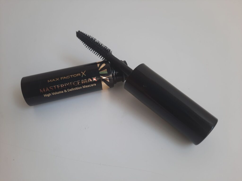 The sample size of the Max Factor Masterpiece Max Mascara which is a black tube with gold accents