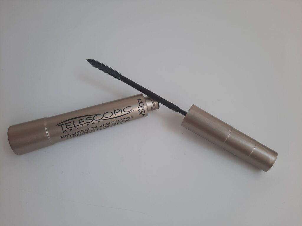 The full size of the L'Oreal Telescopic Mascara which is a beige tube in the shape of a telescope
