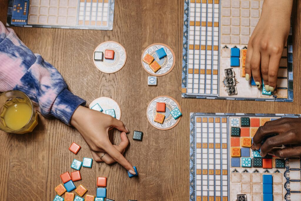 3 women playing a board game together