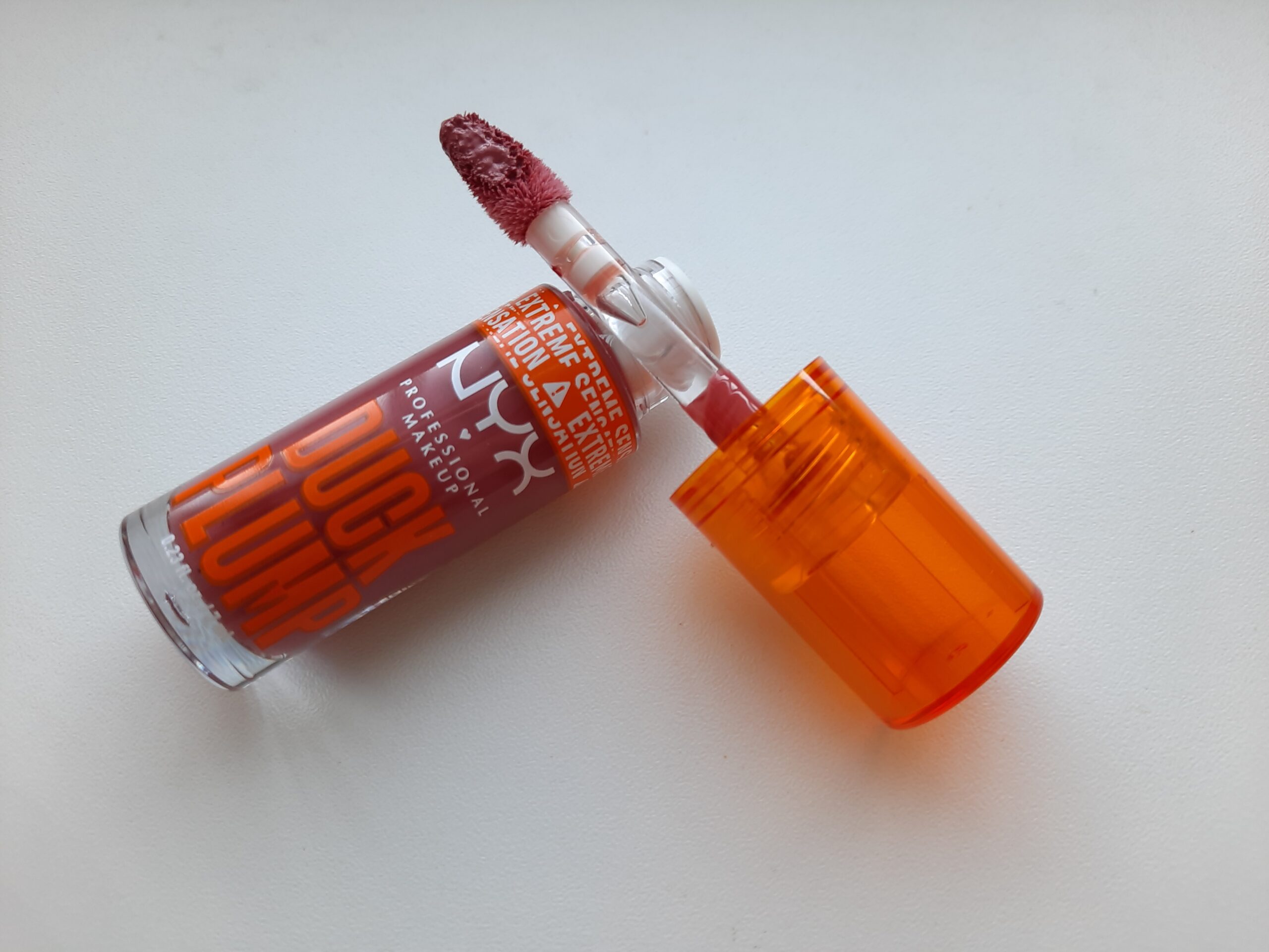 The NYX Duck Plump Lip Gloss in the shade Strike a Rose