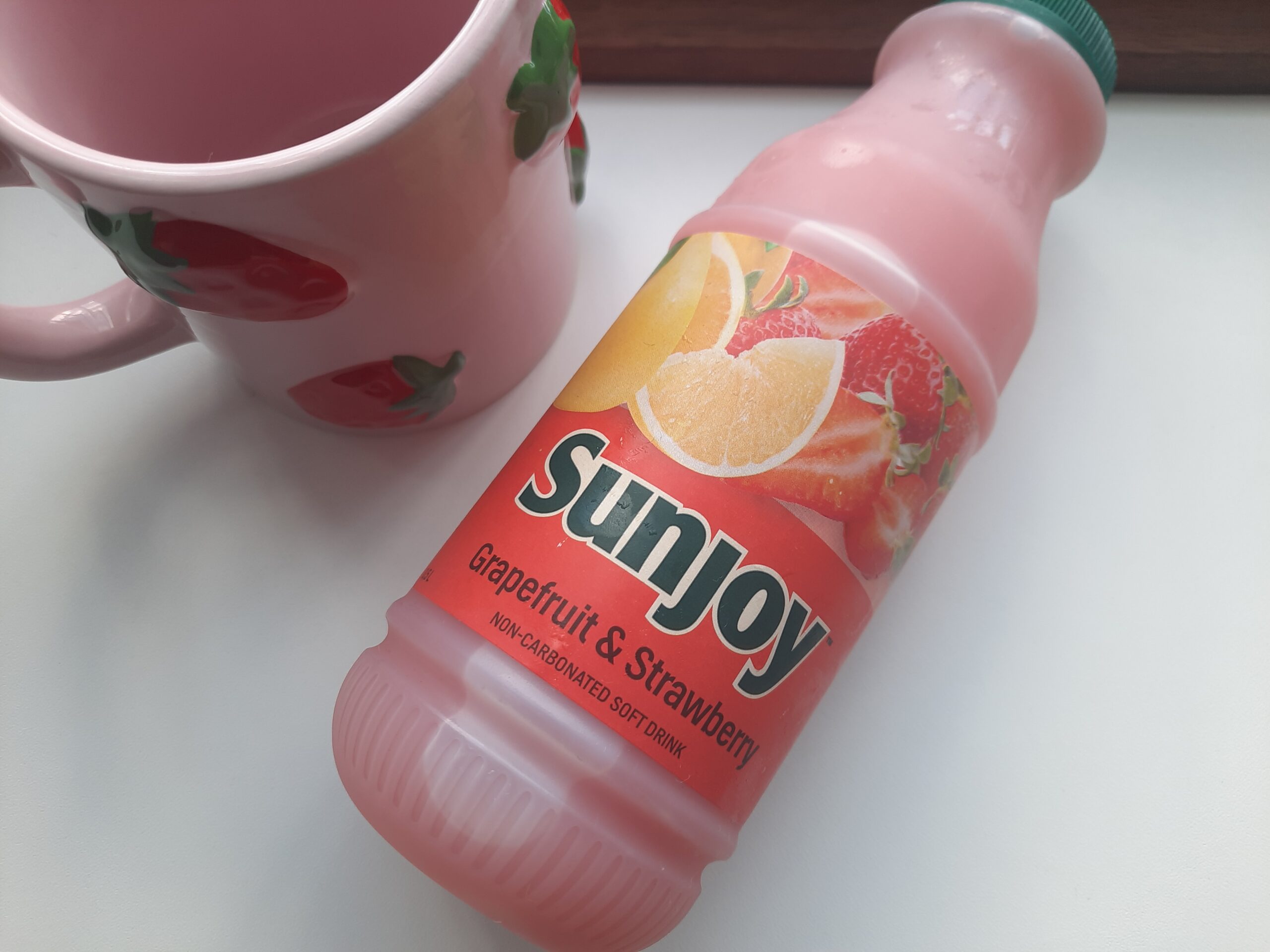 The bottle of the Sunjoy Grapefruit & Strawberry drink.