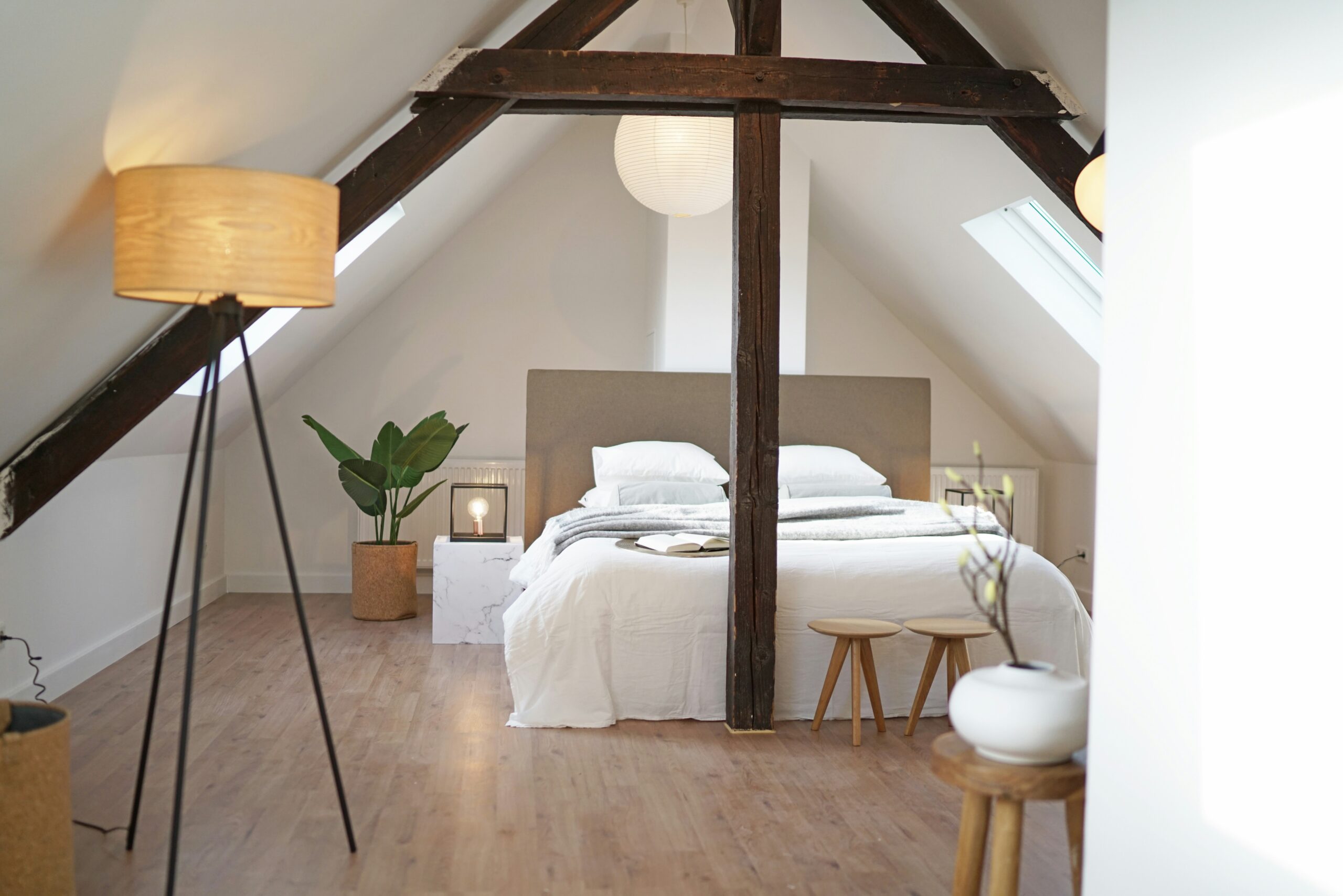 An attic that has been converted into a modern bedroom