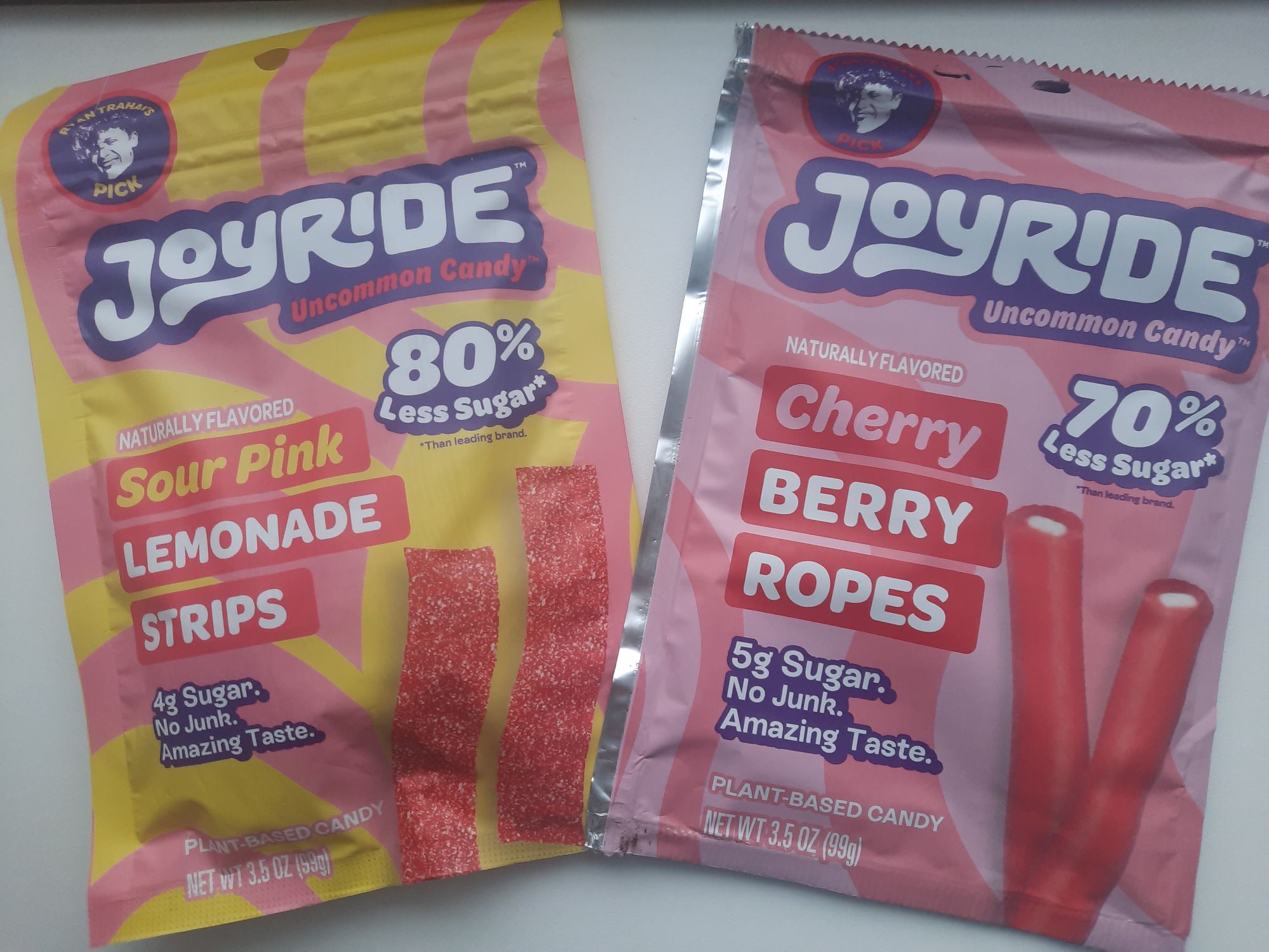 The bags of Joyride Sour Pink Lemonade Strips and Cherry Berry Ropes