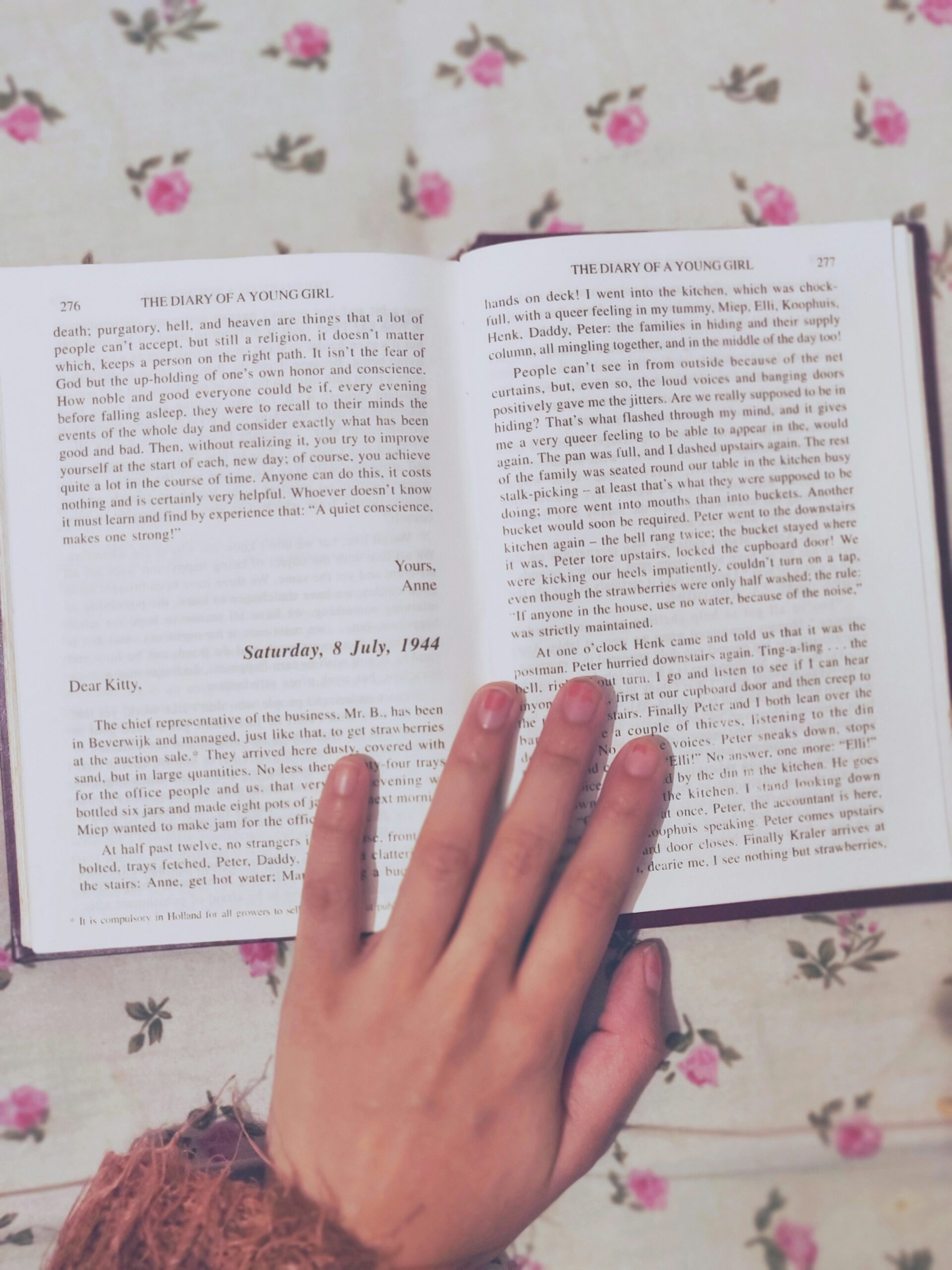 The Diary of a Young Girl by Anne Frank opened to page 276 and 277.