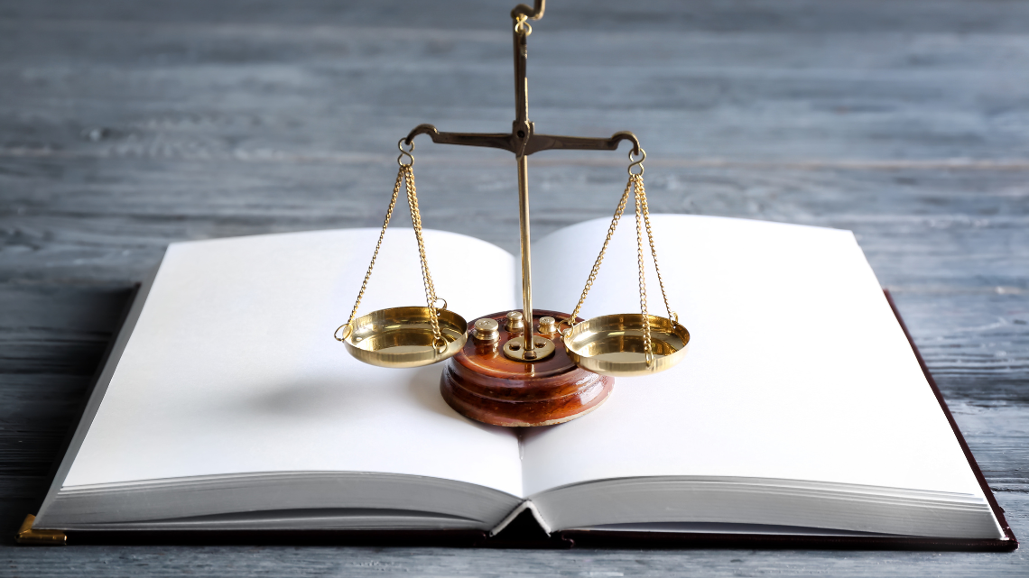 A scale on top of an opened book