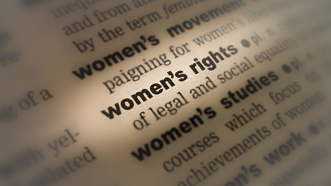 A closeup of a dictionary page defining women's rights
