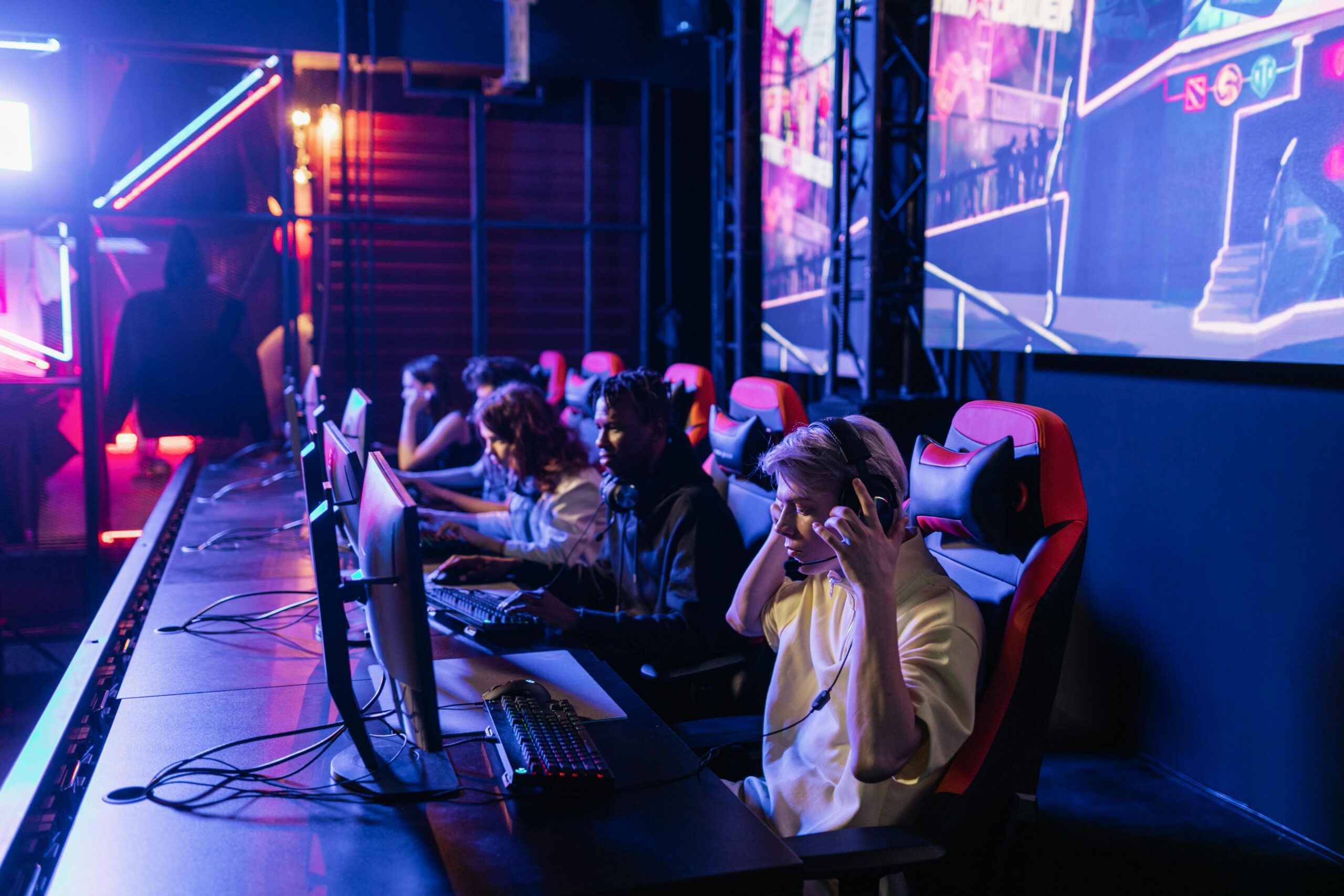 An esports team in front of their computers