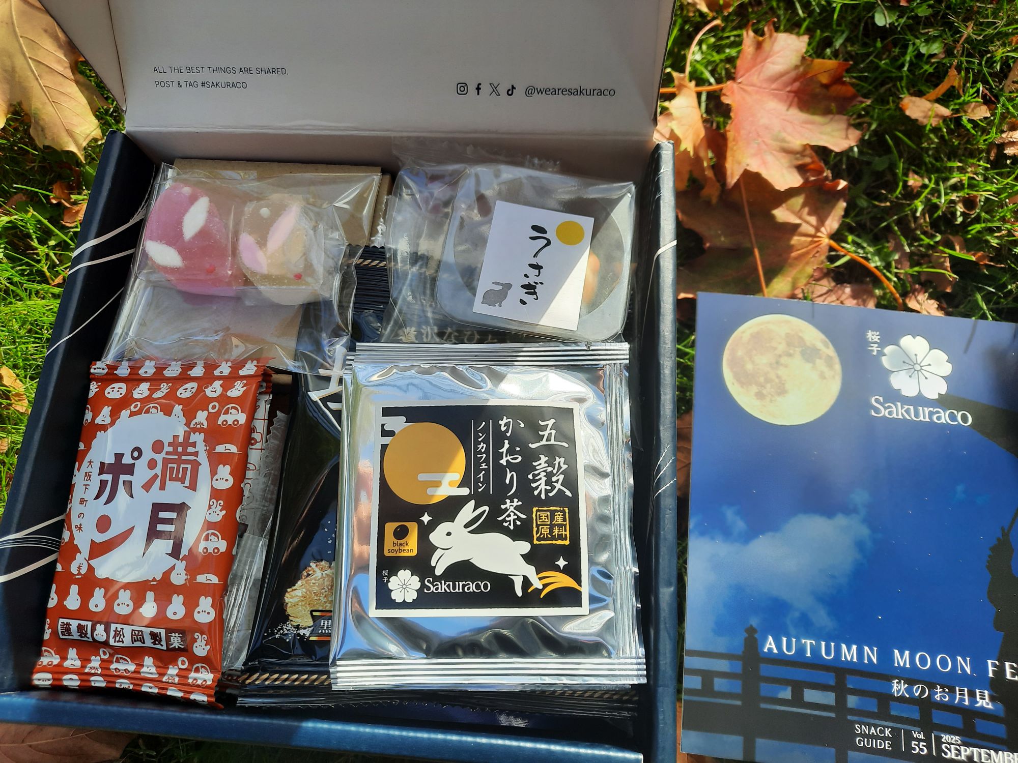 The box opened to show some of the snacks and tea in the box