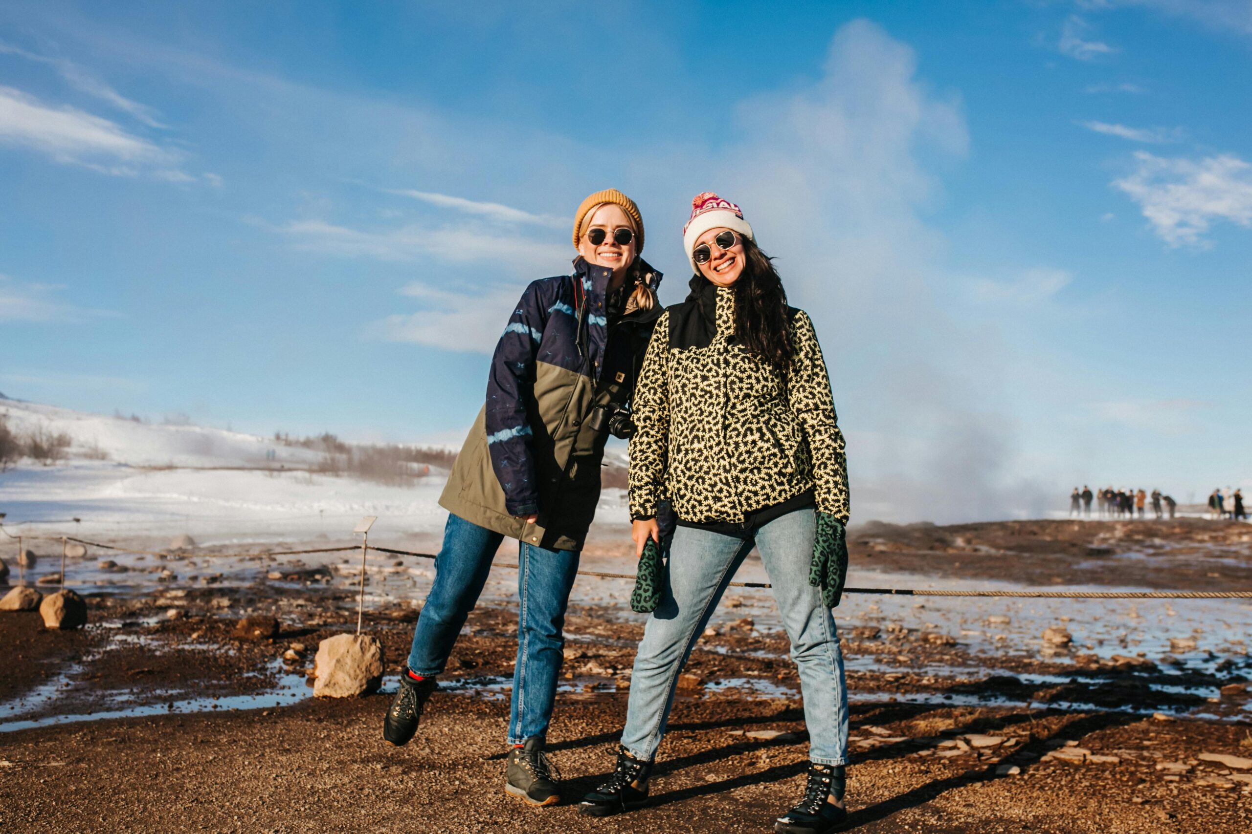Two women wearing winter clothes and smiling