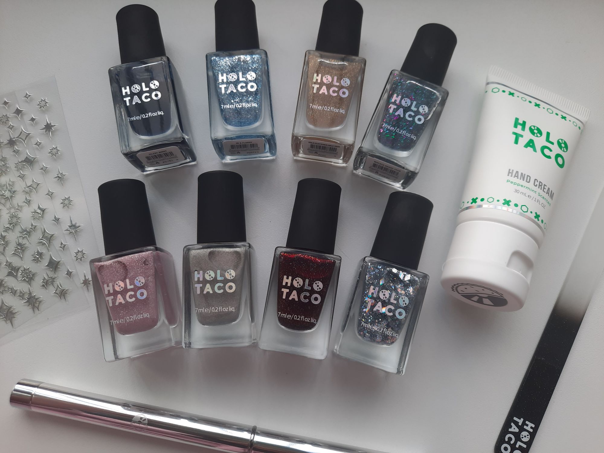 The 8 nail polishes and 4 nail accessories from the Holo Taco Mini Advent Calendar