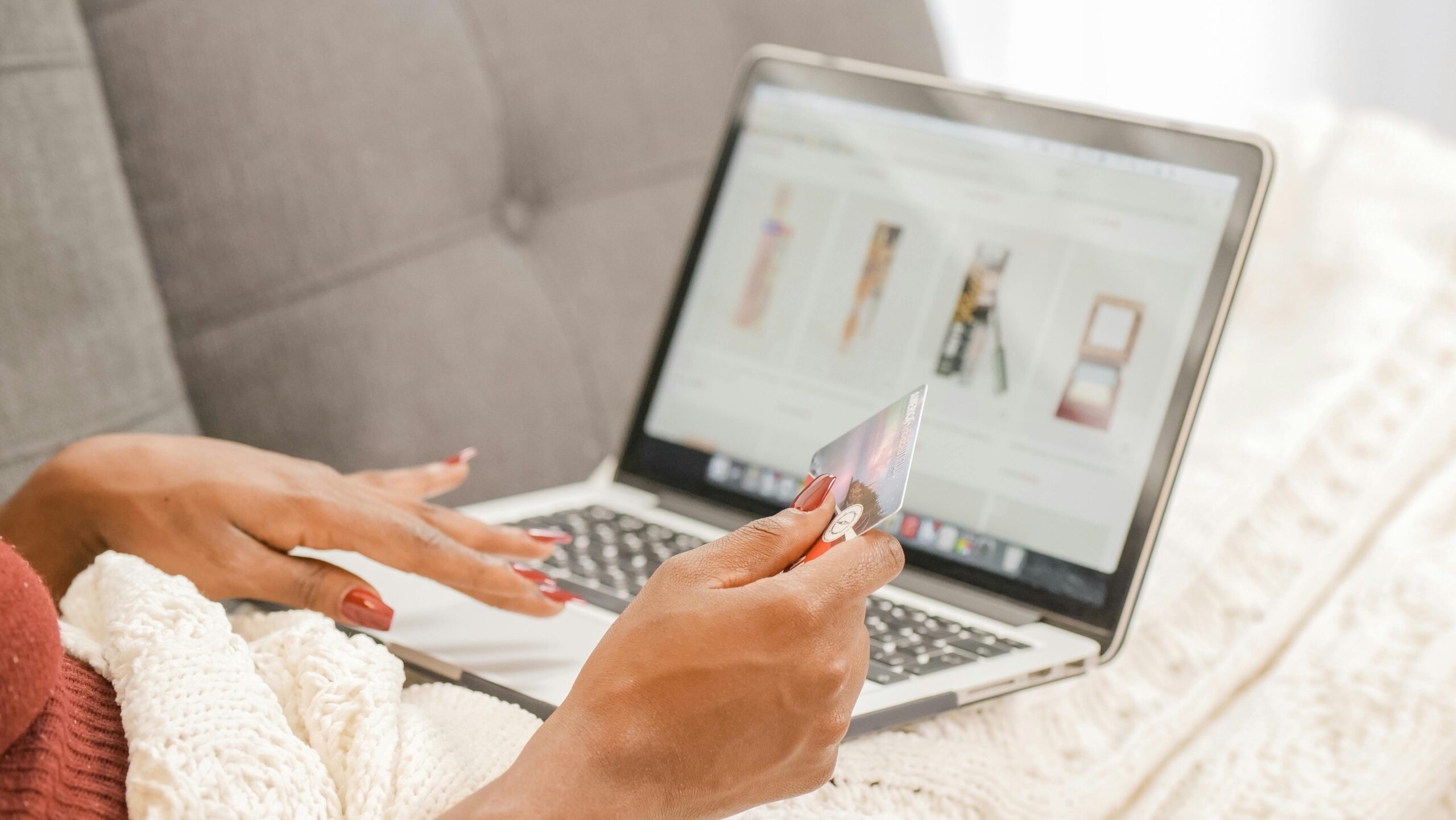 Close up of a person using a laptop and shopping online