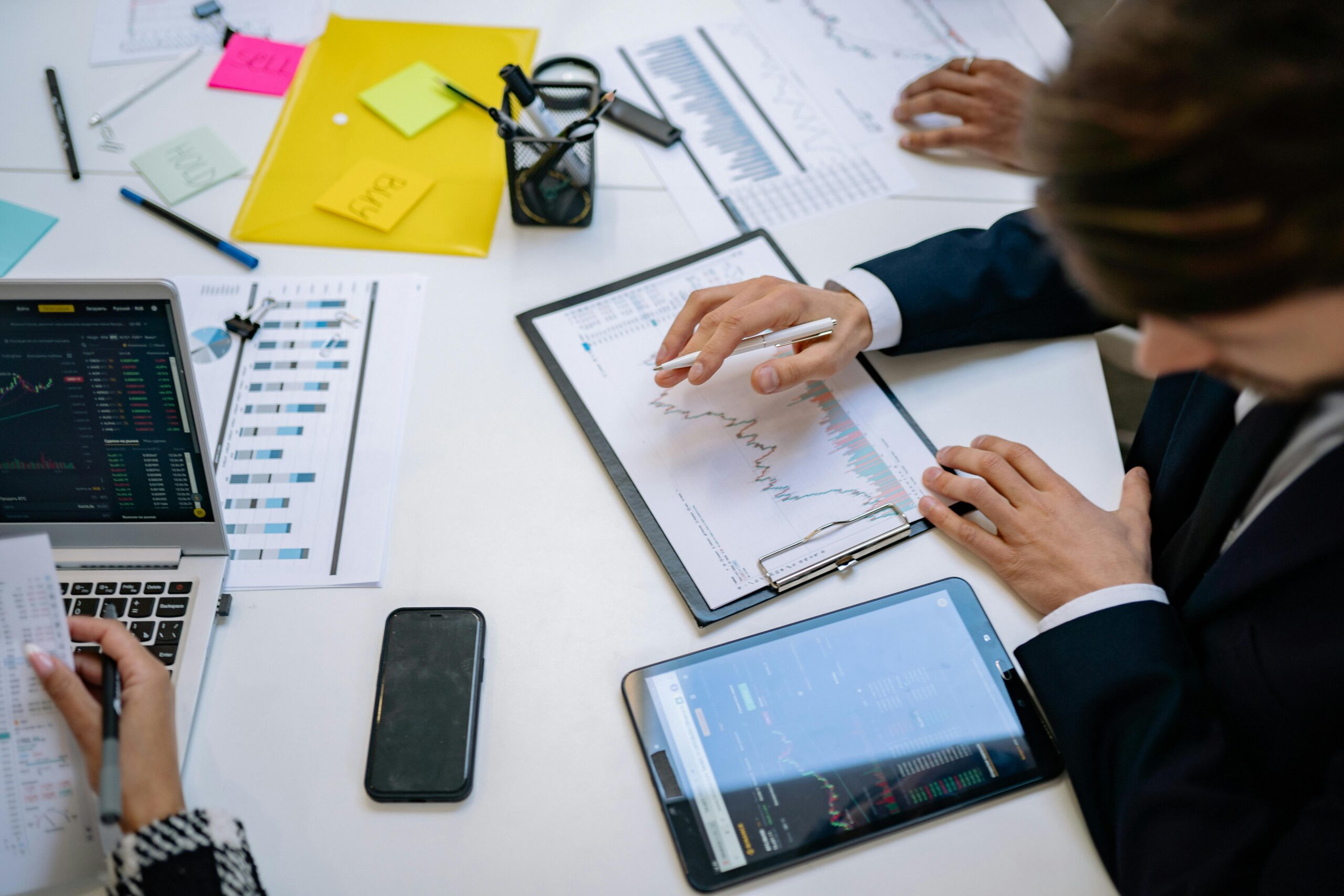 A team looking at charts during a meeting