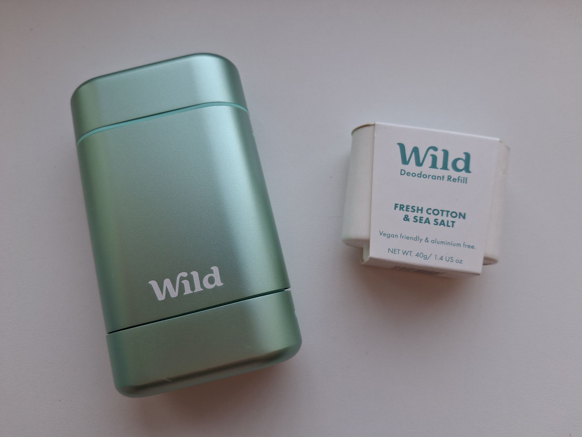 The aqua case of the Stick Deodorant with the fresh cotton & sea salt refill.